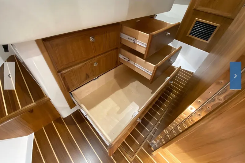 Slide: The Image of Interior view of 2020 Mag Bay 42 yacht showcasing wooden cabinetry and flooring. - 10