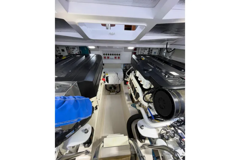 Slide: The Image of Engine room of 2020 Mag Bay 42 boat, showcasing dual engines and mechanical systems. - 12