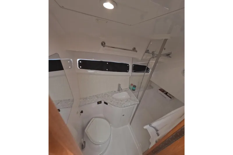 Slide: The Image of Bathroom interior of 2020 Mag Bay 42 yacht, featuring modern fixtures and sleek design. - 22