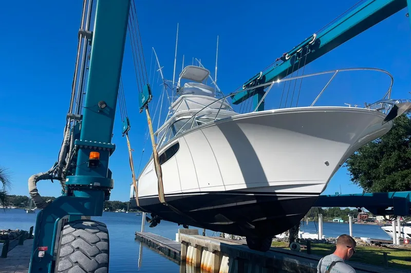 Slide: The Image of 2020 Mag Bay 42 yacht being lifted by crane at marina. - 30