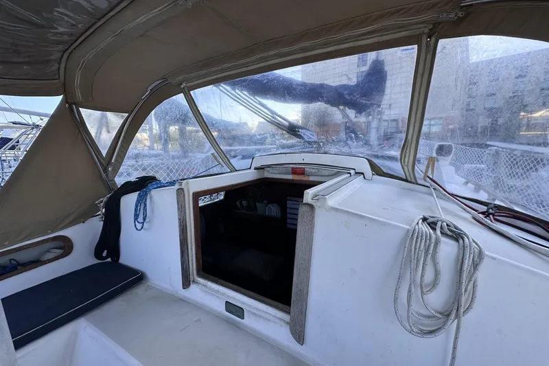 Slide: The Image of Interior view of a 1981 Pearson 424 sailboat cockpit with ropes and seating. - 11
