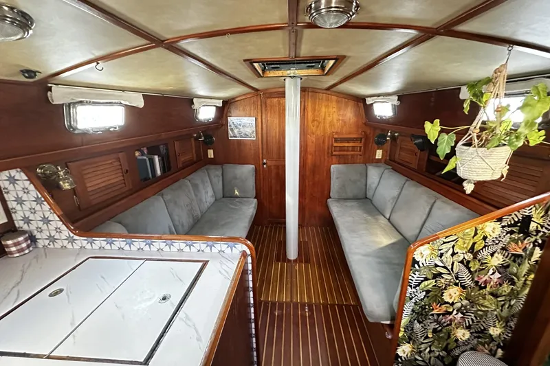 Slide: The Image of Interior of 1981 Pearson 424 sailboat with cozy seating and nautical decor. - 12