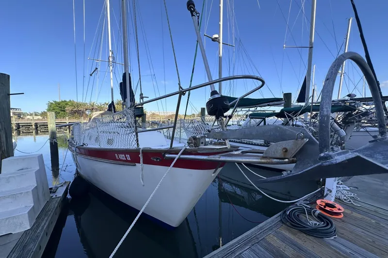 Slide: The Image of Sailboat docked at marina, Pearson 424 model from 1981, with clear blue sky. - 3