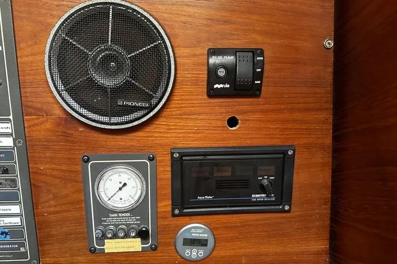Slide: The Image of Control panel on a 1981 Pearson 424 sailboat with speaker and gauges. - 37