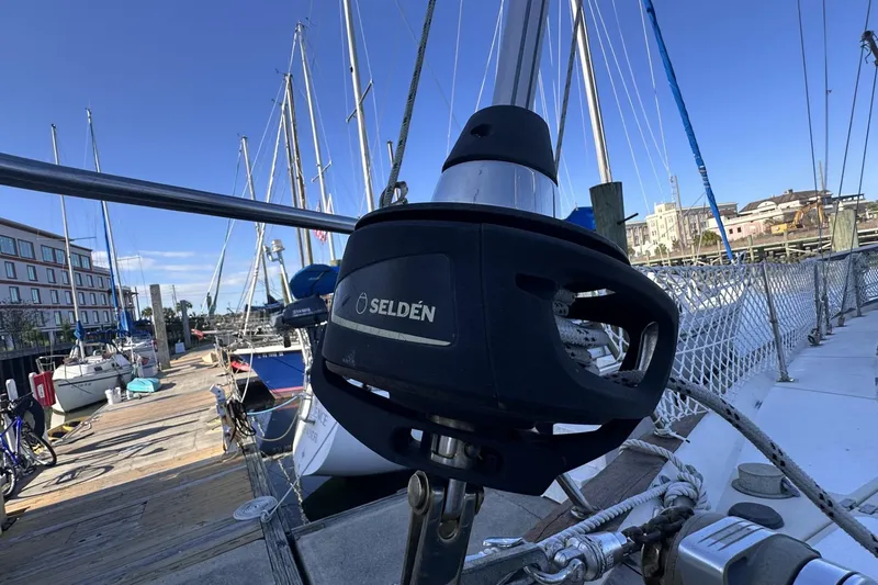Slide: The Image of Sailboat docked at marina, featuring Selden furling system, Pearson 424, 1981 model. - 43