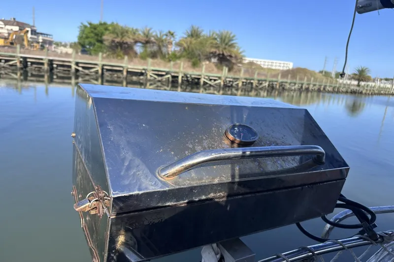Slide: The Image of Stainless steel grill on a Pearson 424 sailboat, docked by calm waters, sunny day. - 45