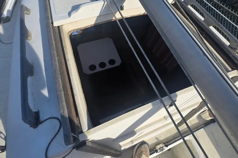 Slide: The Image of Open hatch of a 1986 Sovereign 24 sailboat, showing interior access. - 21