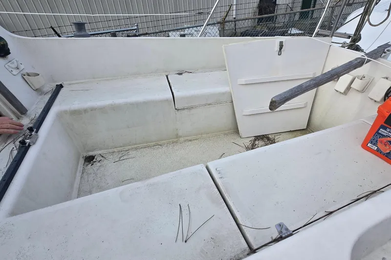 Slide: The Image of Cockpit of a 1986 Sovereign 24 sailboat, showing seating and storage areas. - 5