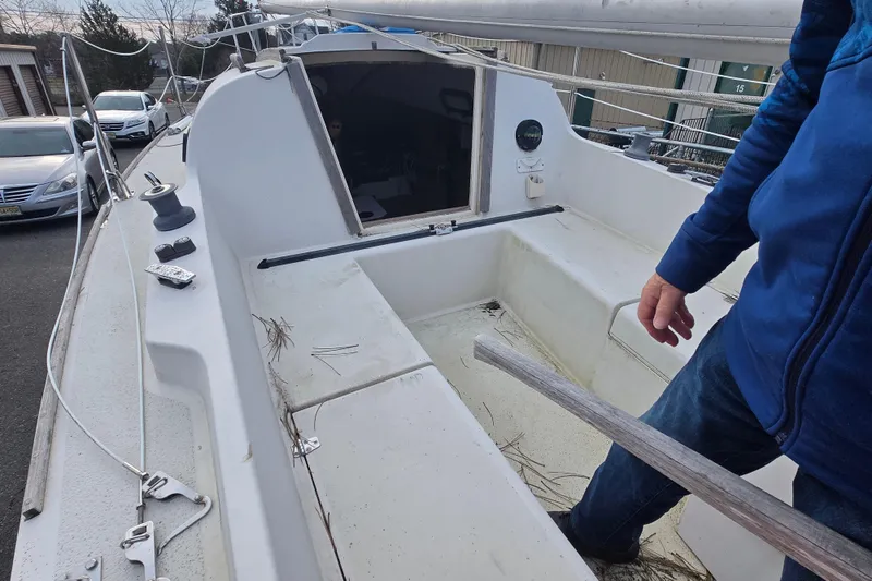 Slide: The Image of 1986 Sovereign 24 sailboat cockpit with visible seating and rigging components. - 6