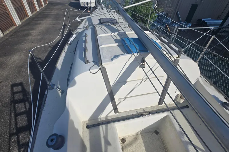 Slide: The Image of 1986 Sovereign 24 sailboat deck with rigging and storage compartments. - 9