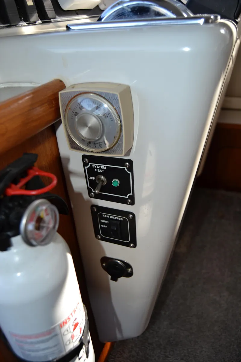 Slide: The Image of Carver 370 Voyager 1994 control panel with fire extinguisher. - 10