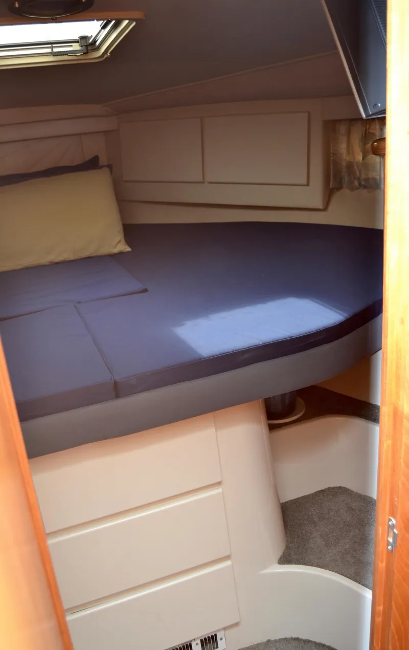 Slide: The Image of Interior of 1994 Carver 370 Voyager with cozy bed. - 11