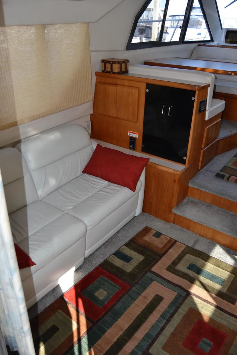 Slide: The Image of Interior of 1994 Carver 370 Voyager with sofa and carpet. - 14