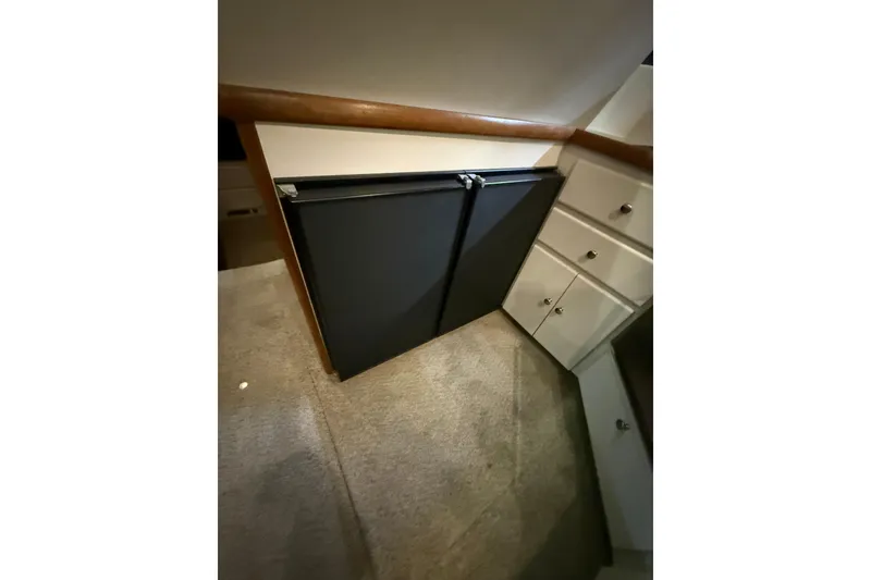 Slide: The Image of Interior of 1994 Carver 370 Voyager showing cabinetry and carpeted flooring. - 21