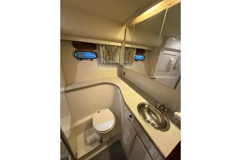Slide: The Image of Bathroom interior of 1994 Carver 370 Voyager yacht with sink and toilet. - 30