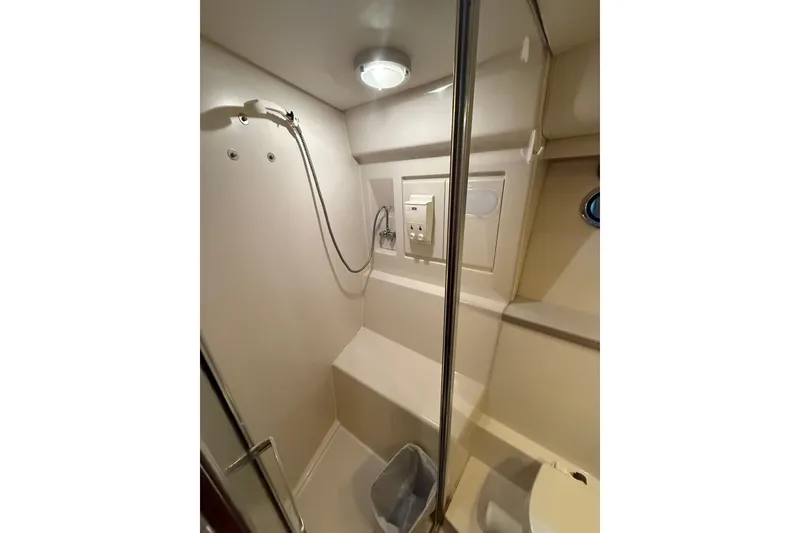 Slide: The Image of Bathroom interior of 1994 Carver 370 Voyager yacht, featuring shower and modern fixtures. - 31