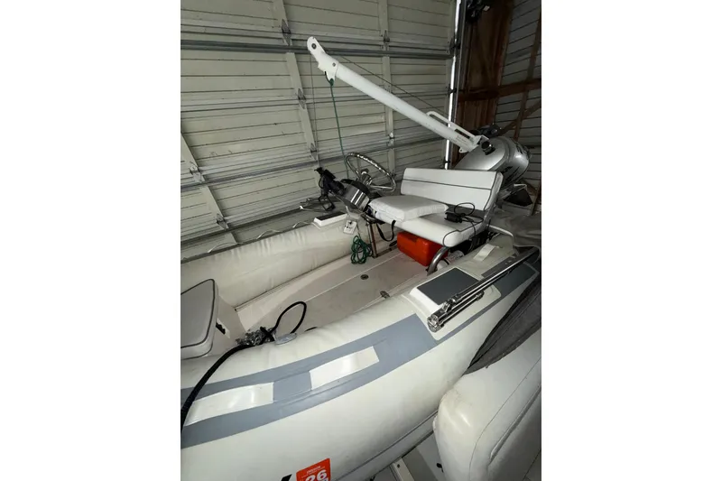 Slide: The Image of 1994 Carver 370 Voyager interior with seating and equipment in a garage setting. - 39