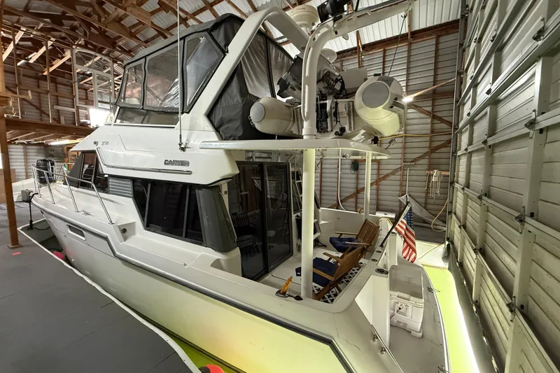 Slide: The Image of 1994 Carver 370 Voyager yacht in a spacious indoor storage facility. - 41