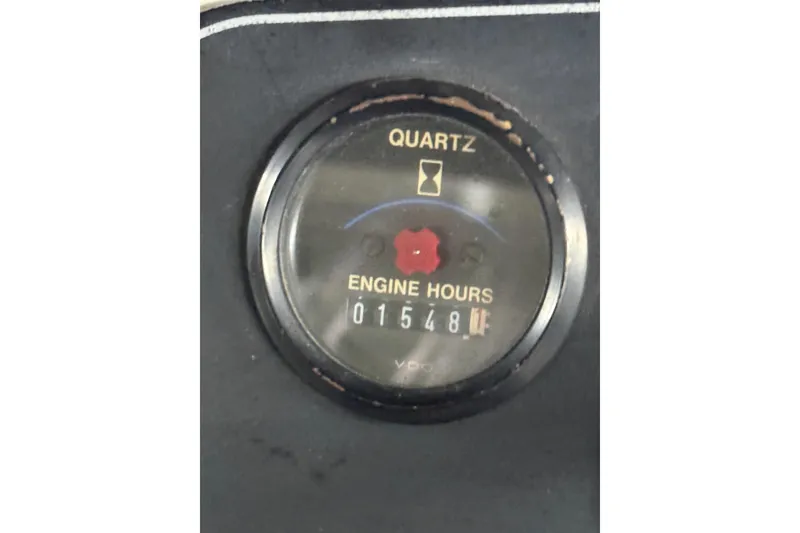 Slide: The Image of Engine hour meter showing 1548 hours on 1994 Carver 370 Voyager. - 49