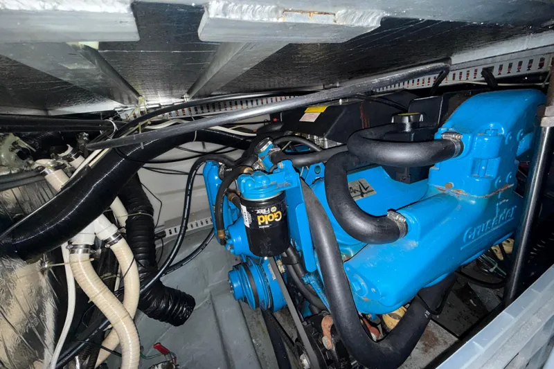 Slide: The Image of Engine room of a 1994 Carver 370 Voyager with visible Crusader engine components. - 50