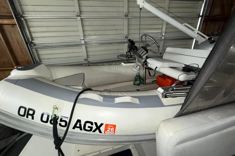 Slide: The Image of Inflatable boat stored in a garage, featuring steering controls and seating. - 58