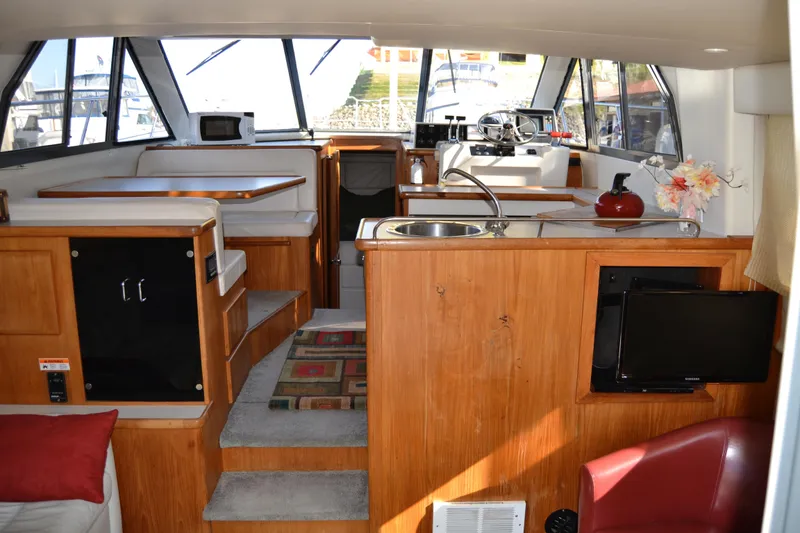 Slide: The Image of Interior of 1994 Carver 370 Voyager yacht with modern amenities. - 6