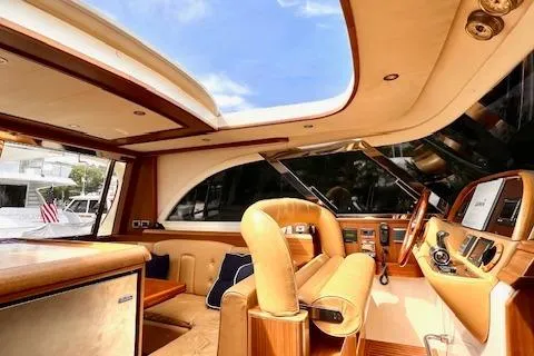 Slide: The Image of Interior of 2006 Mochi Craft 51 Dolphin yacht with luxurious seating and modern dashboard. - 8