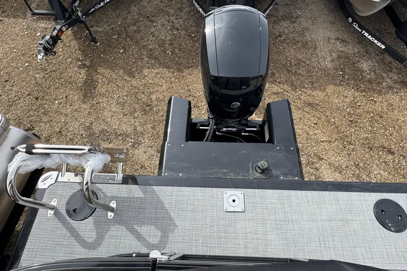 Slide: The Image of 2025 Regency 230 DL3 boat with outboard motor, viewed from above. - 14