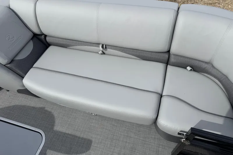 Slide: The Image of 2025 Regency 230 DL3 boat interior with sleek gray seating and modern design. - 5