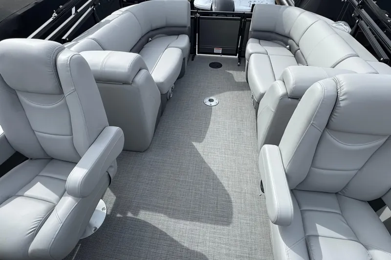 Slide: The Image of Luxurious seating on 2025 Regency 230 DL3 pontoon boat, featuring plush gray upholstery. - 8