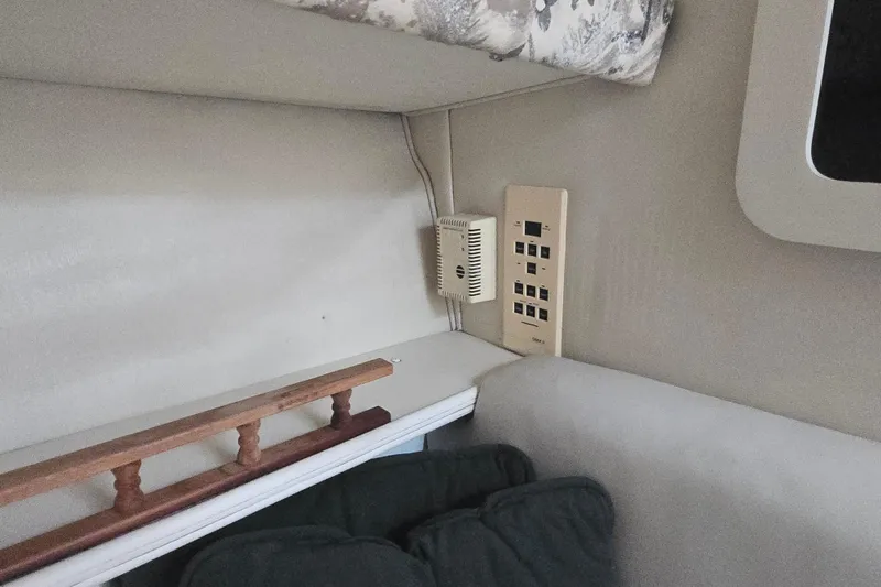 Slide: The Image of Interior of 1998 Wellcraft 330 Coastal boat showing control panel and seating area. - 15