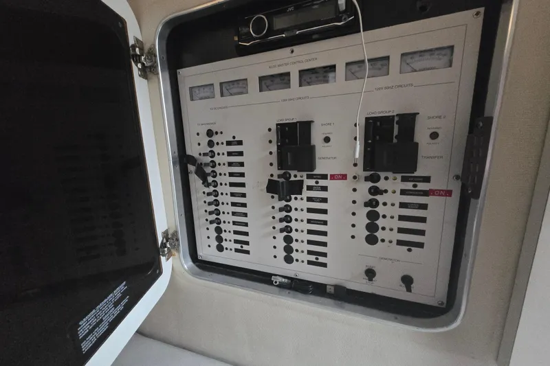 Slide: The Image of Electrical control panel inside a 1998 Wellcraft 330 Coastal boat. - 26
