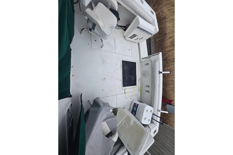 Slide: The Image of 1998 Wellcraft 330 Coastal boat interior with seating and storage compartments. - 5