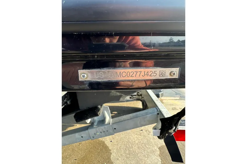 Slide: The Image of 2025 Yamaha Boats AR220 hull identification number plate on trailer. - 12