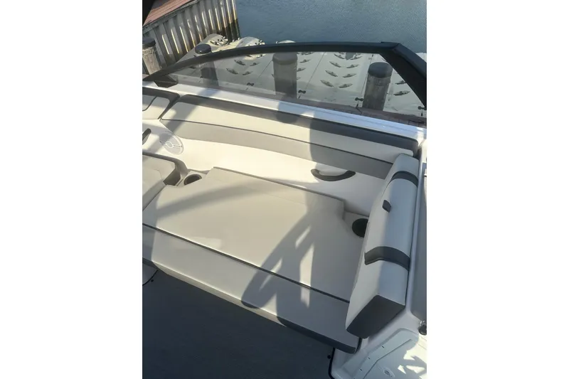 Slide: The Image of 2025 Yamaha Boats AR220 interior seating with sleek design and comfortable upholstery. - 14