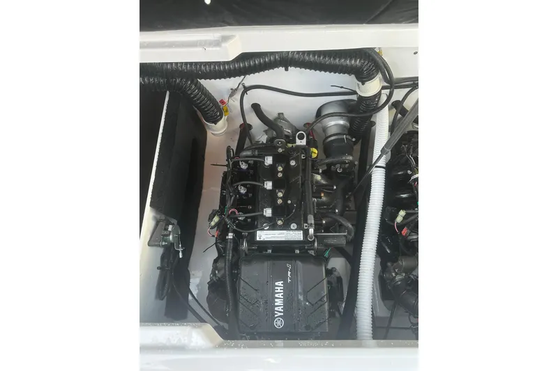 Slide: The Image of Engine compartment of 2025 Yamaha Boats AR220, showcasing intricate mechanical components. - 15