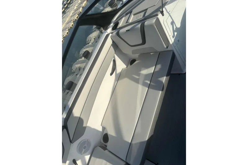Slide: The Image of 2025 Yamaha Boats AR220 interior seating with sleek design and modern features. - 16