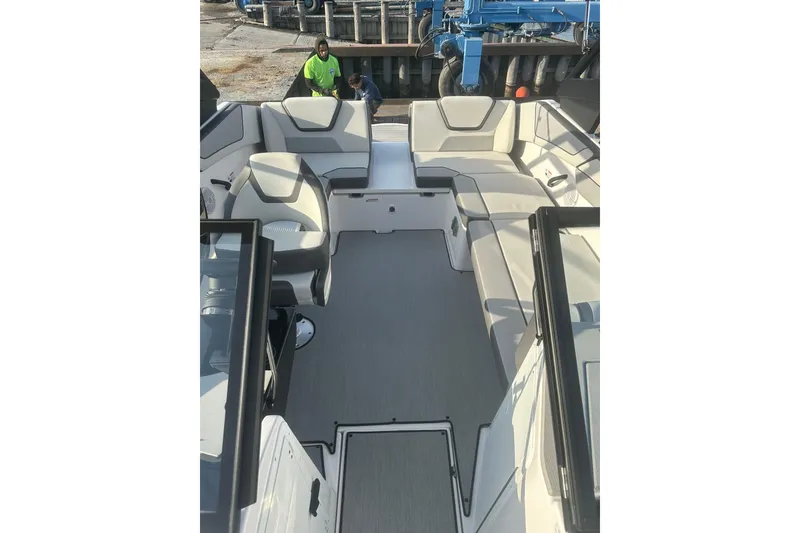 Slide: The Image of 2025 Yamaha Boats AR220 interior with spacious seating and modern design. - 19