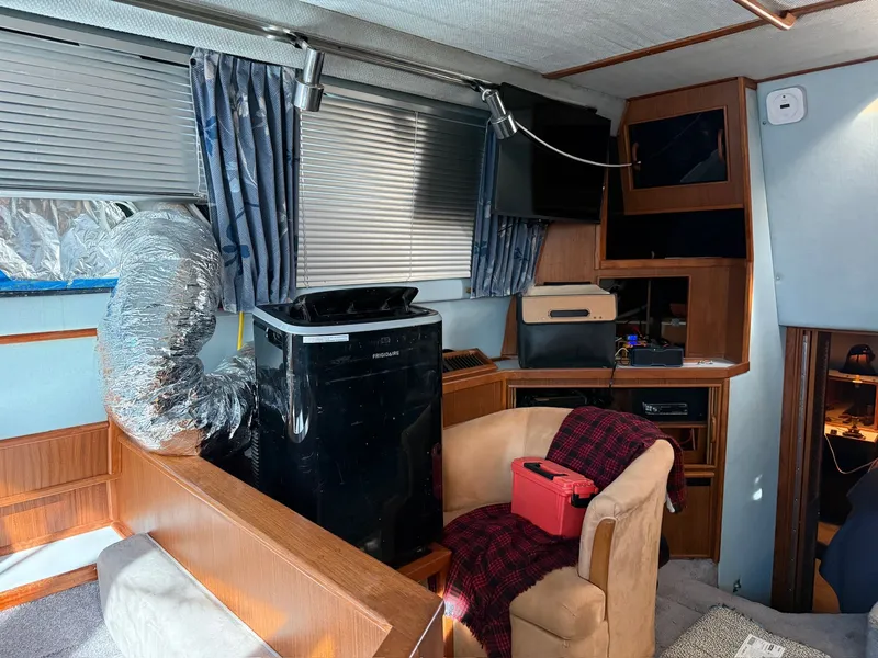 Slide: The Image of Interior of a 1988 Sea Ray 415 Aft Cabin with modern amenities. - 10