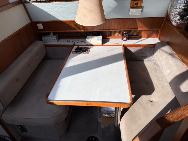 Slide: The Image of Interior of 1988 Sea Ray 415 Aft Cabin with dining table. - 11