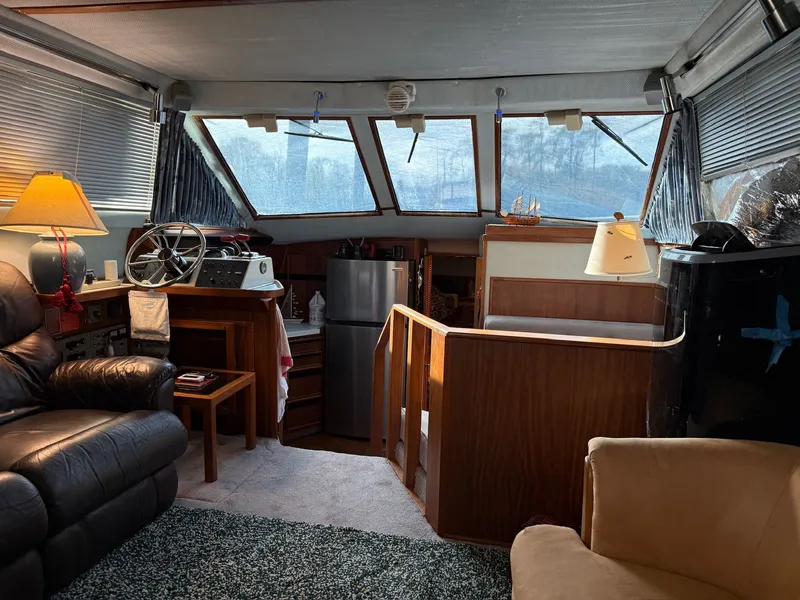 Slide: The Image of Interior of a 1988 Sea Ray 415 Aft Cabin yacht with cozy furnishings. - 13