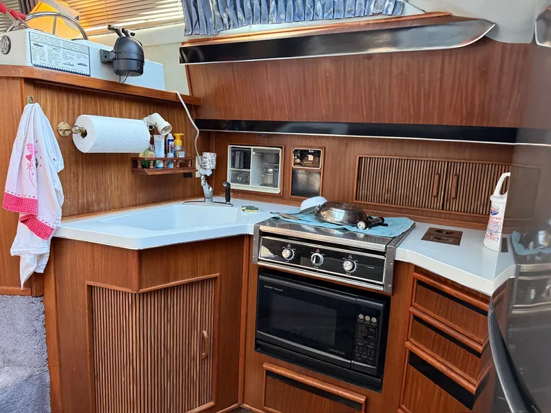 Slide: The Image of Sea Ray 415 Aft Cabin yacht kitchen, 1988 model. - 14