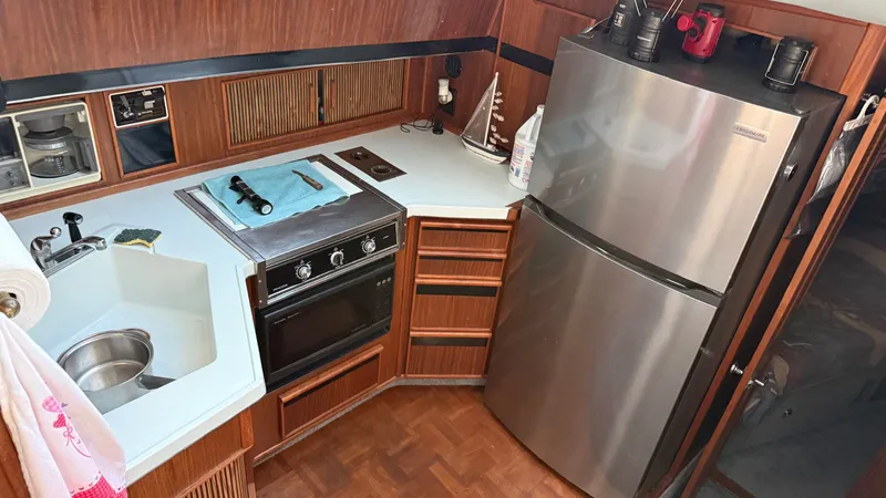 Slide: The Image of Kitchen of 1988 Sea Ray 415 Aft Cabin yacht. - 16