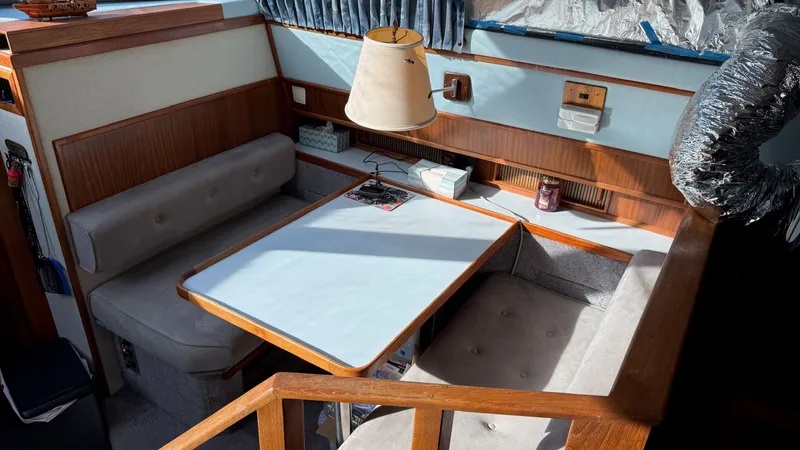Slide: The Image of Interior of 1988 Sea Ray 415 Aft Cabin with dining table. - 20