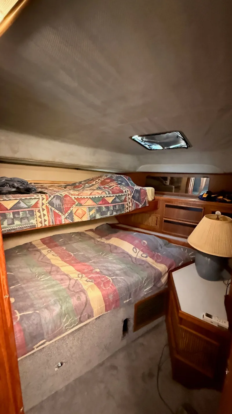 Slide: The Image of Interior of 1988 Sea Ray 415 Aft Cabin with bunk beds. - 21