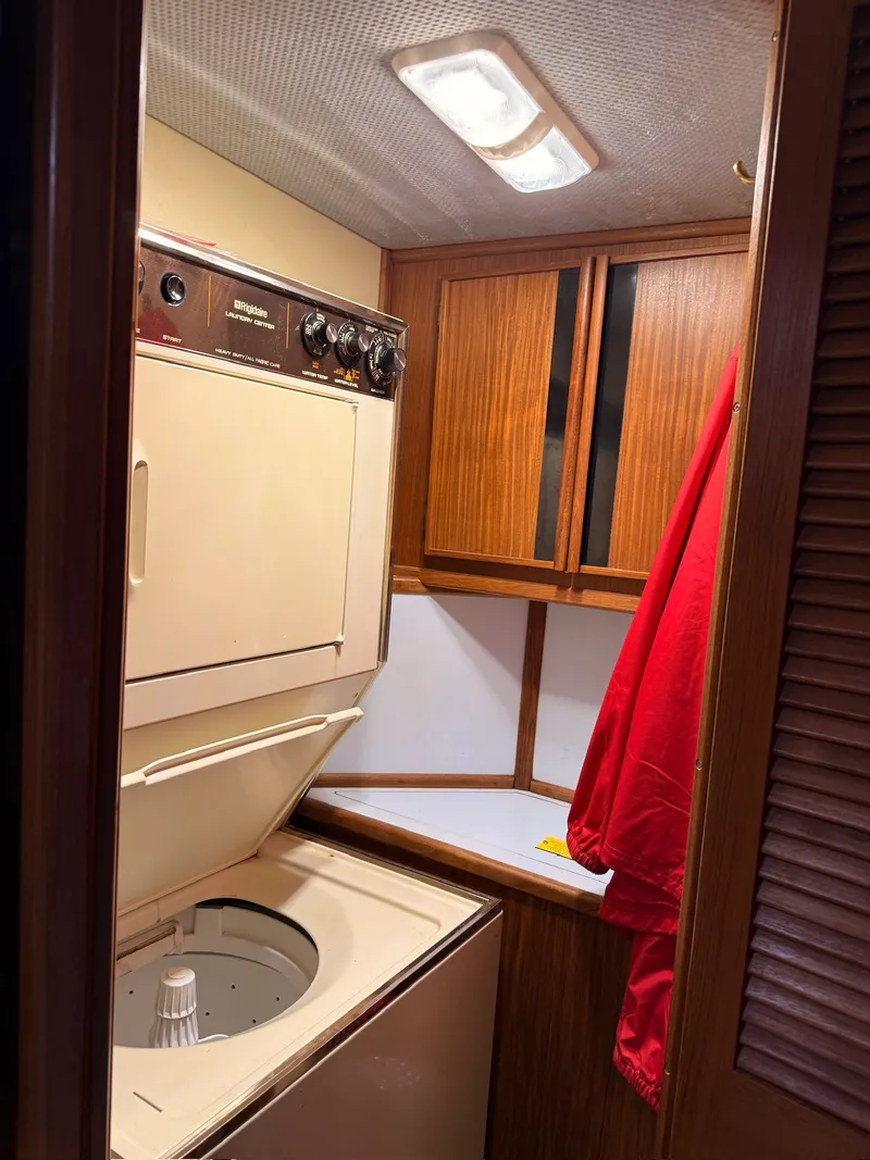Slide: The Image of Laundry area in a 1988 Sea Ray 415 Aft Cabin yacht. - 28