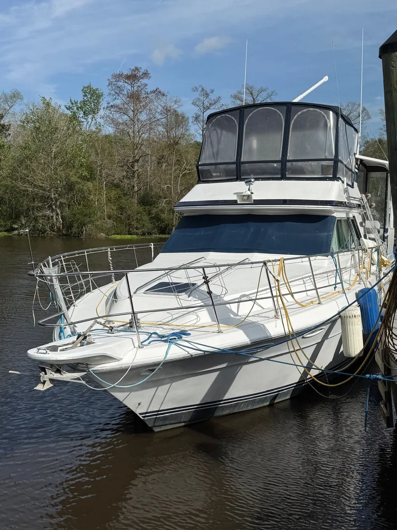Slide: The Image of 1988 Sea Ray 415 Aft Cabin yacht docked. - 3