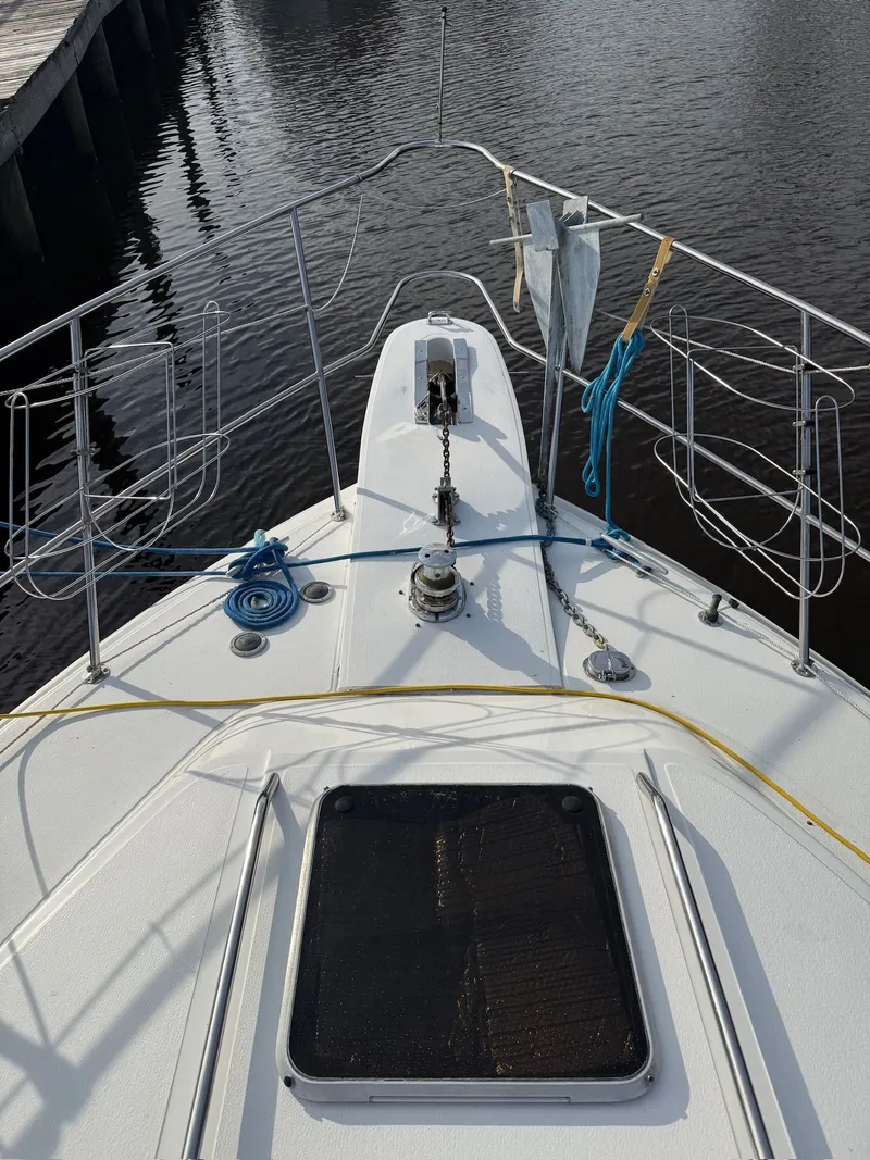 Slide: The Image of 1988 Sea Ray 415 Aft Cabin boat deck with anchor and ropes. - 35