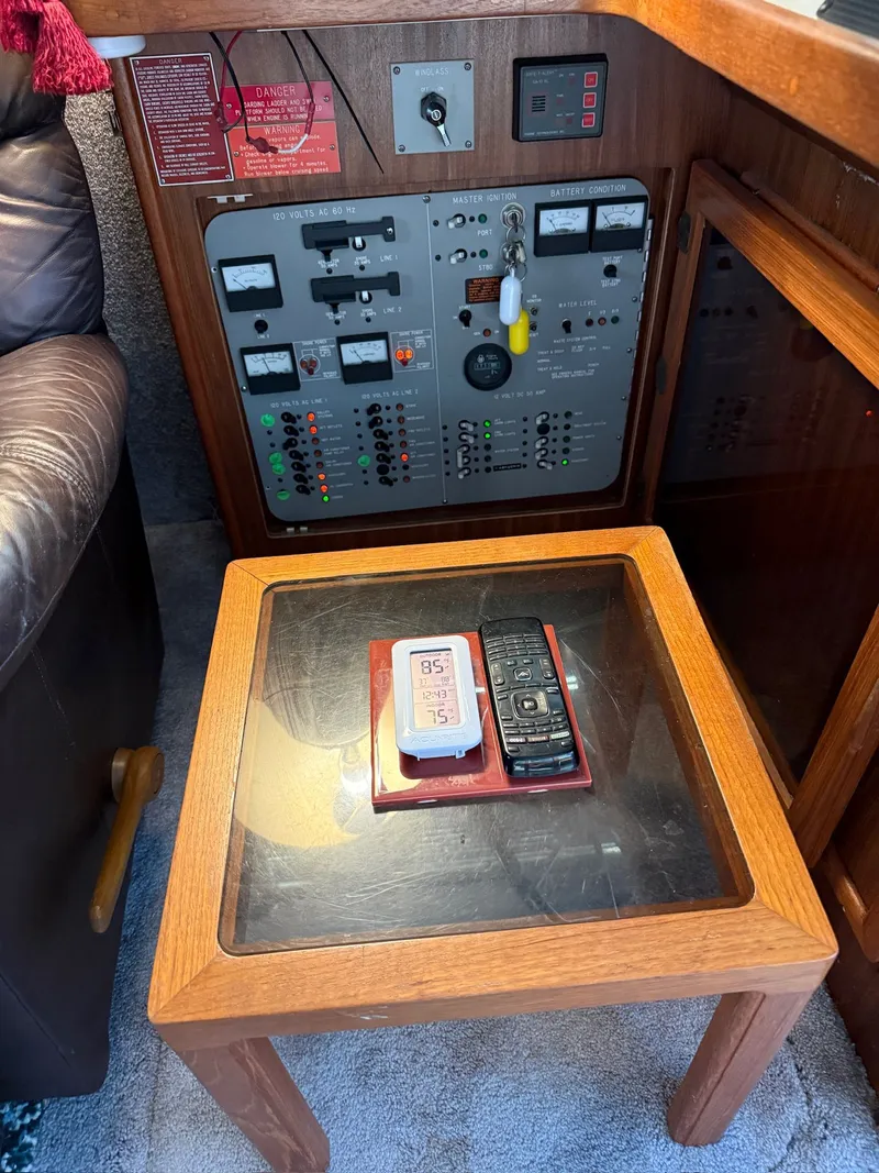 Slide: The Image of Interior of 1988 Sea Ray 415 Aft Cabin with control panel. - 7