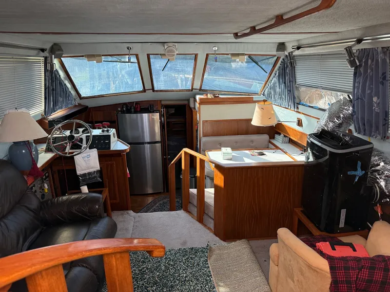 Slide: The Image of Interior of a 1988 Sea Ray 415 Aft Cabin yacht with cozy furnishings. - 8